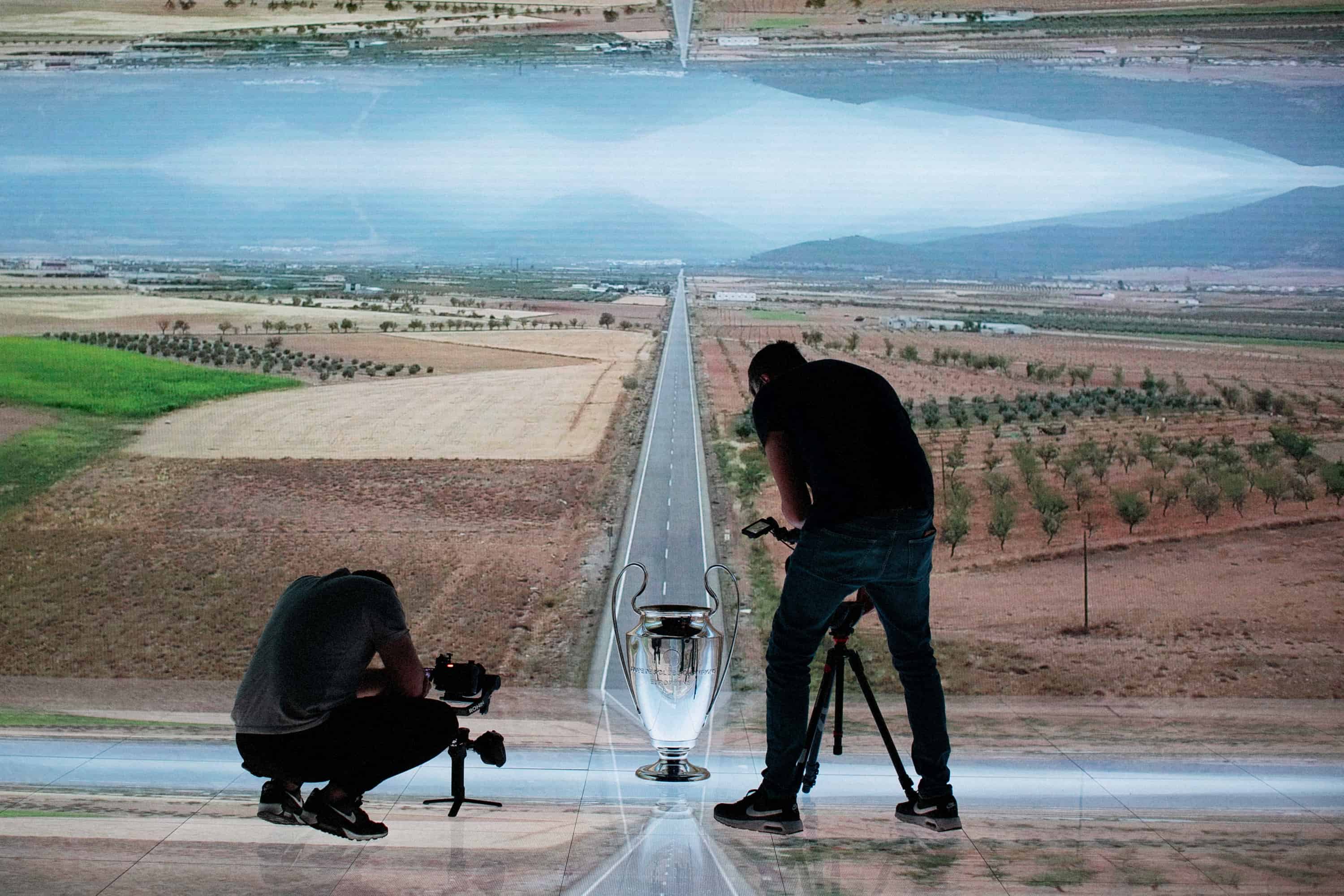 Camera crew filming a Champions League advert on an LED virtual production floor and wall supplied by Dynamo