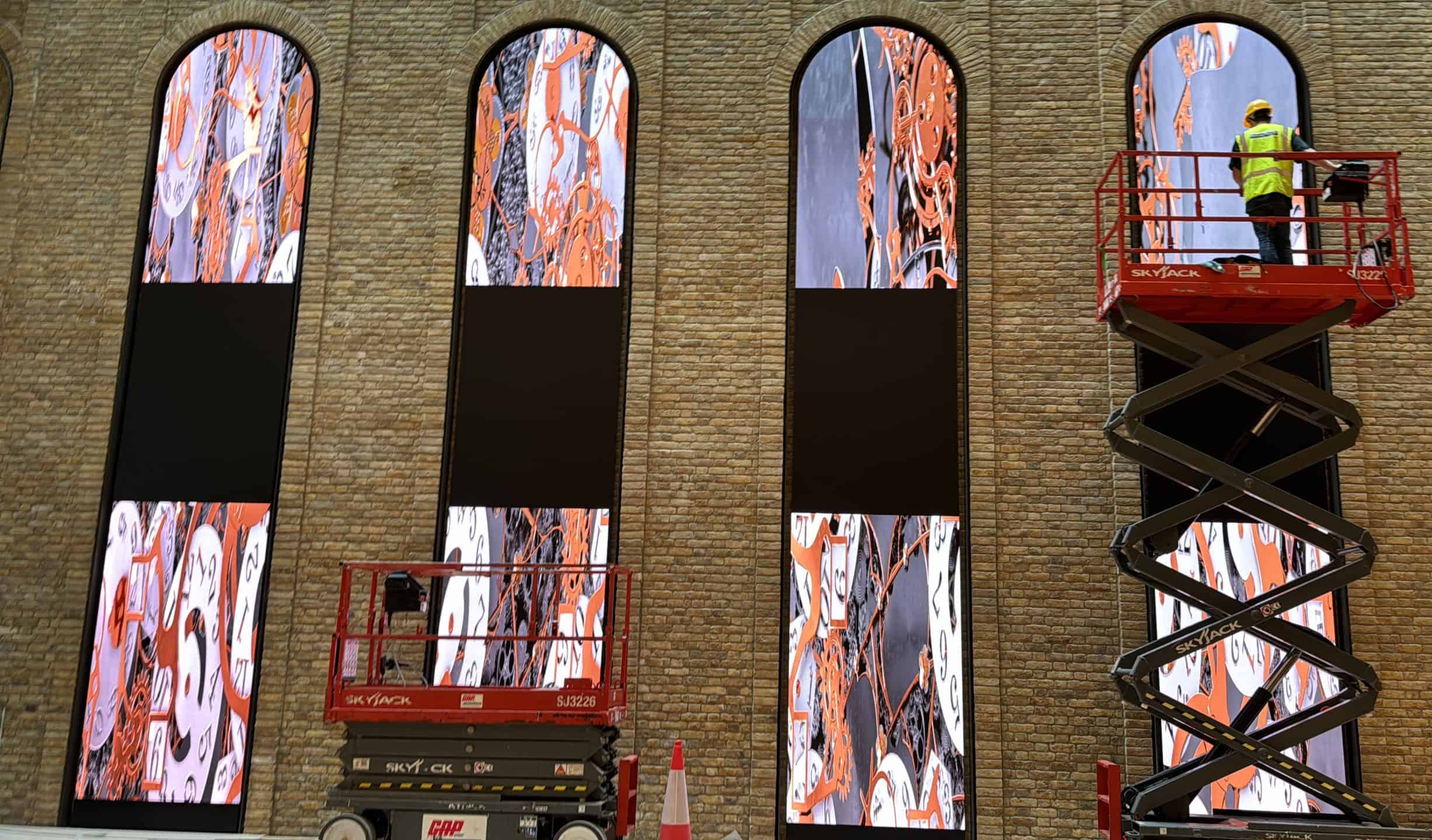 Installation details that decide sign-off โ led screen fire rating โ led screen installation being carried out by workmen on