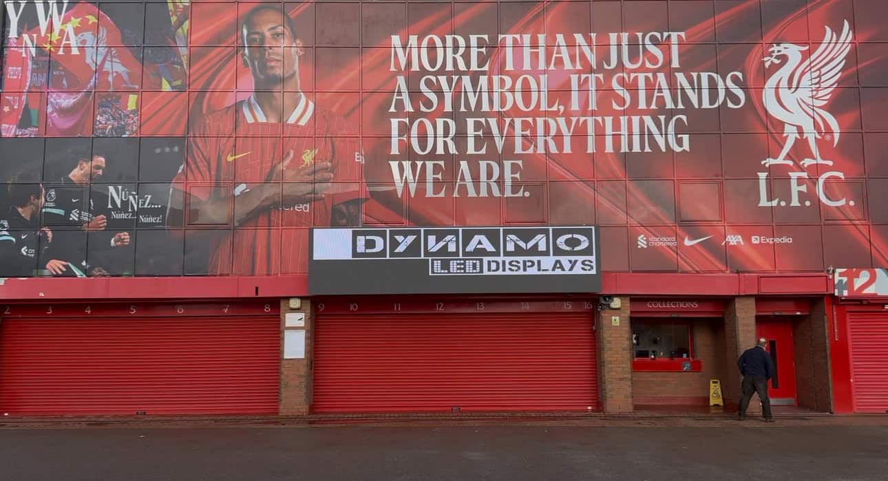 Outdoor LED display on Liverpool FC stadium exterior requiring auto-brightness control for day-to-night transitions