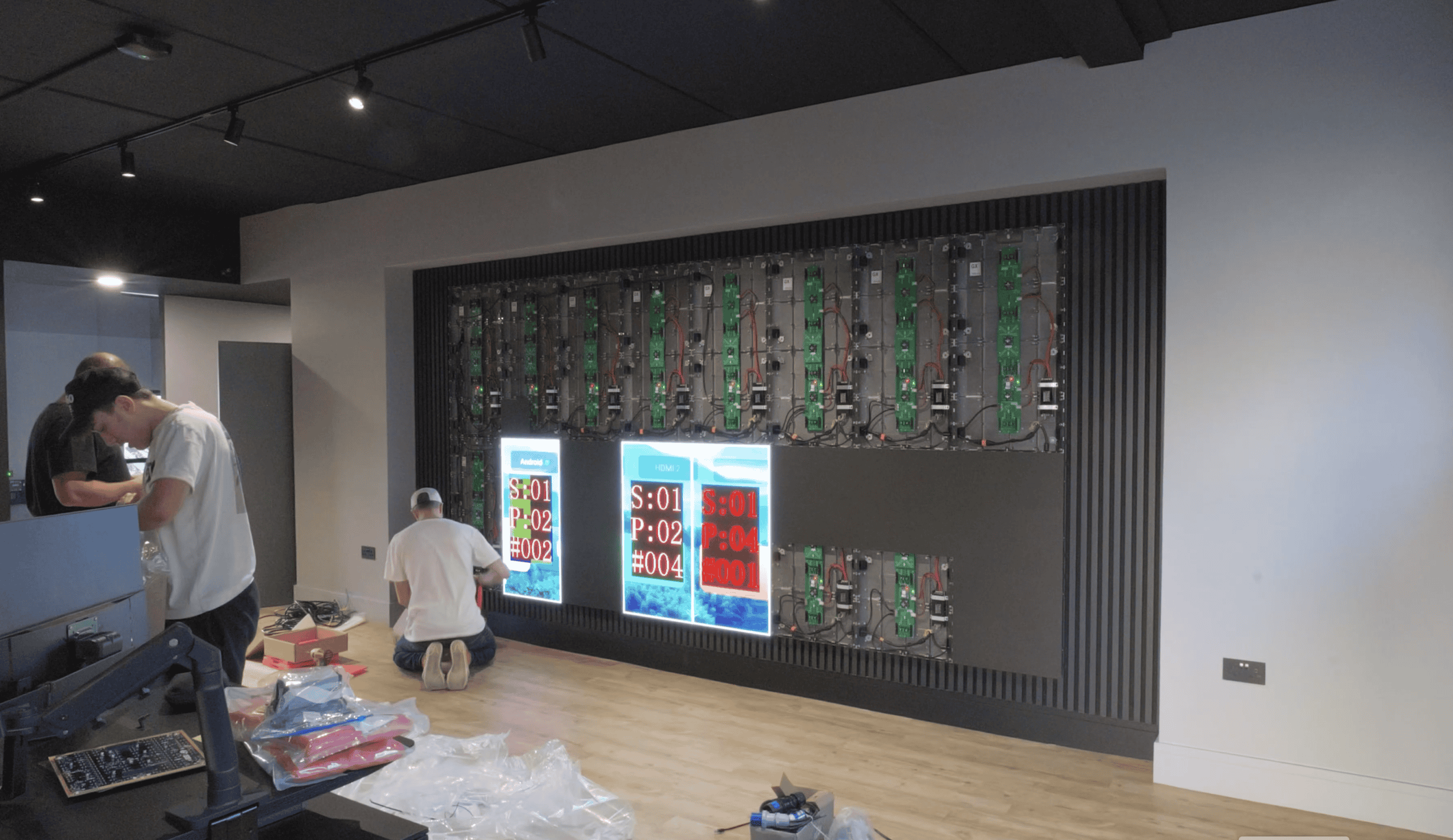 Front-service indoor LED video wall installation showing accessible panel design for maintenance in acoustic-treated rooms