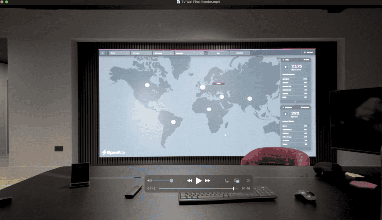 Wall‑mounted office LED video wall in a modern showroom meeting space