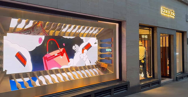 Transparent LED screens installed in a commercial environment showing glass integration