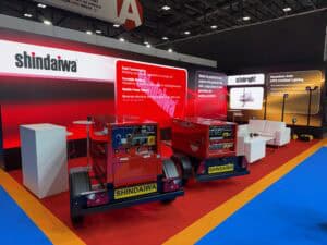 Right‑angle (L‑shape) exhibition LED wall on a shelf for Shindaiwa stand at Coventry Building Society Arena.