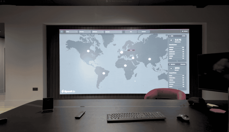 Modern boardroom featuring a seamless LED video wall displaying financial data.