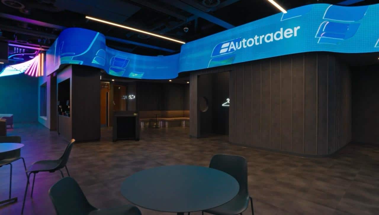 AutoTrader Manchester HQ — interactive AI LED wall by Pixel Artworks rendering an animated aircraft scene generated from a visitor text prompt