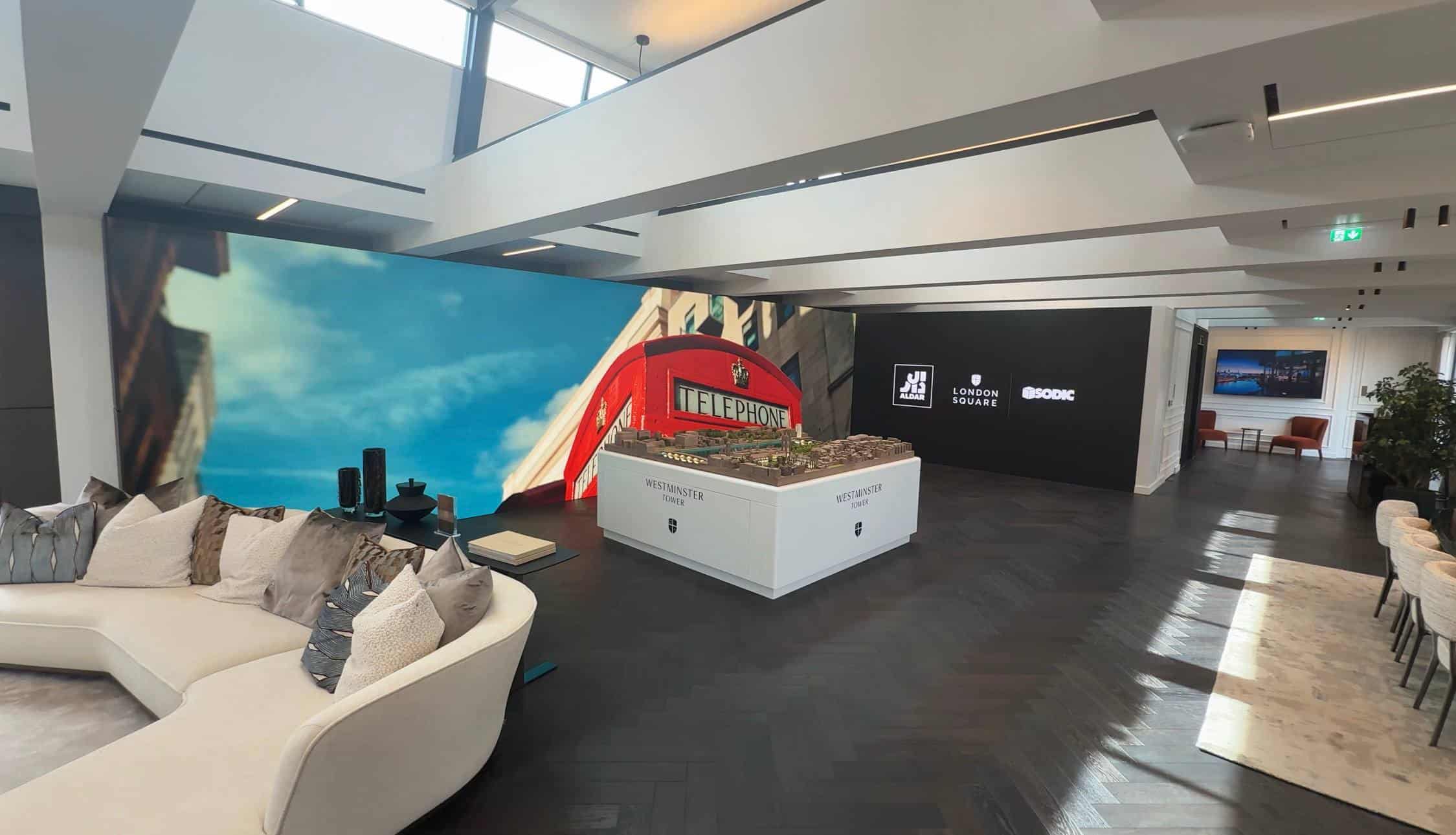 L-shaped LED video wall in Westminster Tower marketing suite Mayfair showing Thames panorama at dusk