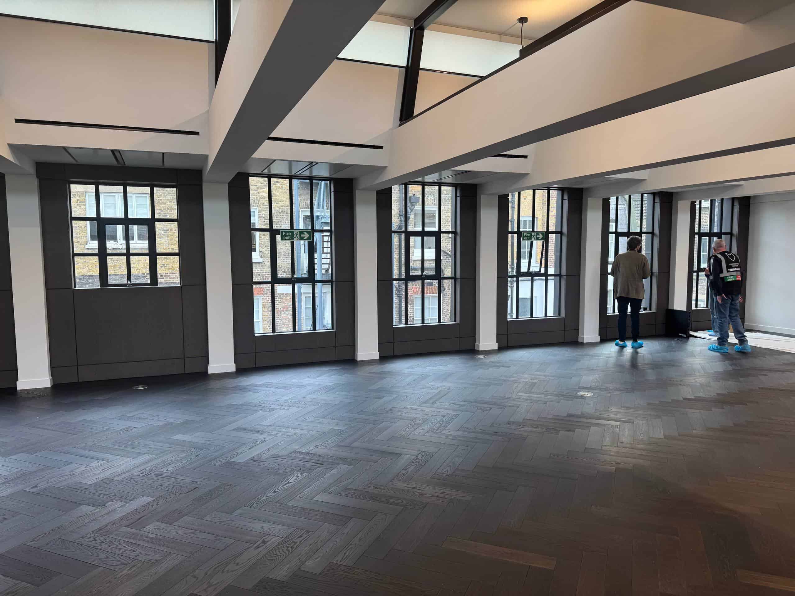 Before: empty marketing suite on Bruton Street Mayfair with real windows facing a brick wall