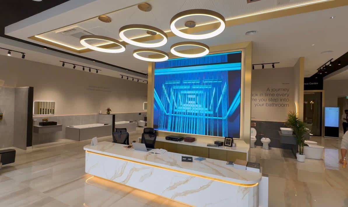 Where should an LED screen go in a kitchen or furniture showroom? โ LED video wall behind a showroom reception desk