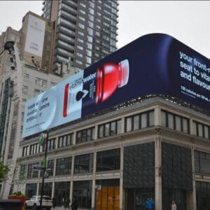 DHB Series high-brightness LED cabinets in a curved wrap-around installation turning a street corner
