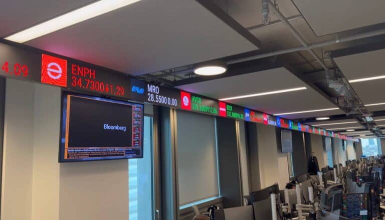 35 m trading floor LED ticker set into the ceiling line above the window wall at PIMCO's 25 Baker Street office, London